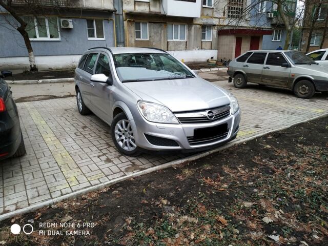 Серый Опель Астра Н, объемом двигателя 1.8 л и пробегом 165 тыс. км за 5600 $, фото 1 на Automoto.ua