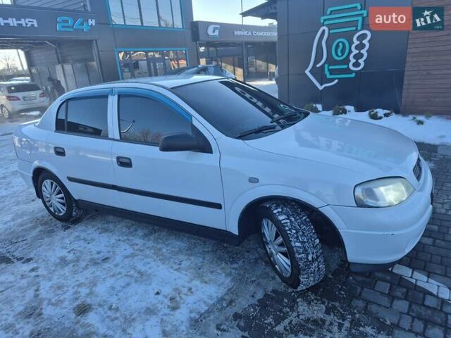 Белый Опель Астра, объемом двигателя 1.4 л и пробегом 224 тыс. км за 3650 $, фото 1 на Automoto.ua