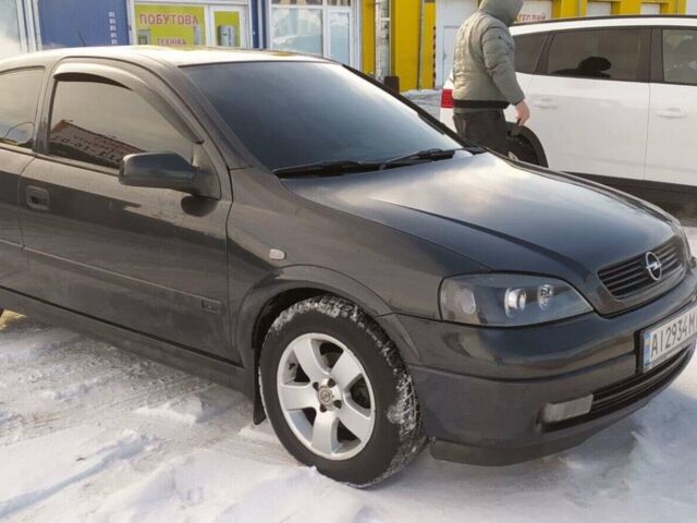 Черный Опель Астра, объемом двигателя 1.6 л и пробегом 385 тыс. км за 3900 $, фото 1 на Automoto.ua