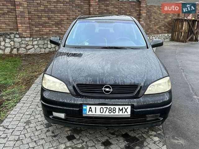 Черный Опель Астра, объемом двигателя 1.6 л и пробегом 330 тыс. км за 3200 $, фото 1 на Automoto.ua
