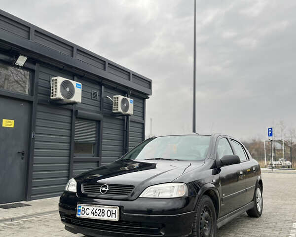 Черный Опель Астра, объемом двигателя 1.36 л и пробегом 82 тыс. км за 4000 $, фото 1 на Automoto.ua