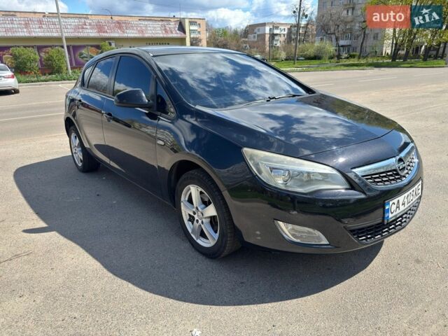 Черный Опель Астра, объемом двигателя 1.25 л и пробегом 256 тыс. км за 4600 $, фото 1 на Automoto.ua