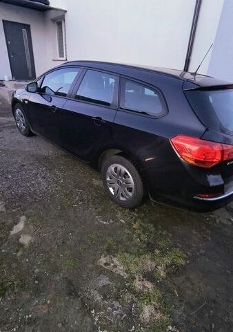 Черный Опель Астра, объемом двигателя 1.25 л и пробегом 304 тыс. км за 7500 $, фото 1 на Automoto.ua