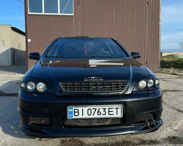 Черный Опель Астра, объемом двигателя 2.2 л и пробегом 297 тыс. км за 3700 $, фото 1 на Automoto.ua