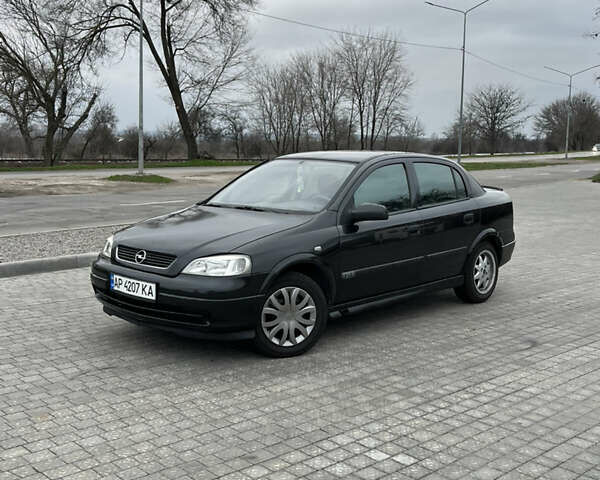 Черный Опель Астра, объемом двигателя 1.6 л и пробегом 205 тыс. км за 1999 $, фото 1 на Automoto.ua