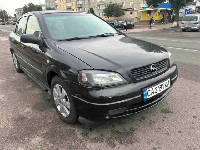Черный Опель Астра, объемом двигателя 1.6 л и пробегом 290 тыс. км за 3000 $, фото 1 на Automoto.ua