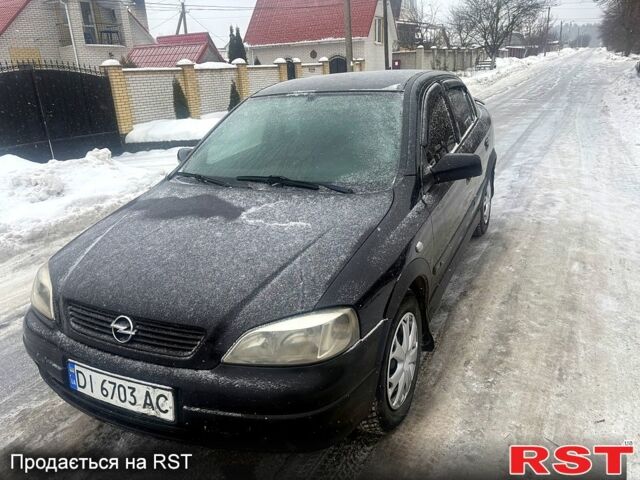 Черный Опель Астра, объемом двигателя 1.4 л и пробегом 280 тыс. км за 3200 $, фото 1 на Automoto.ua