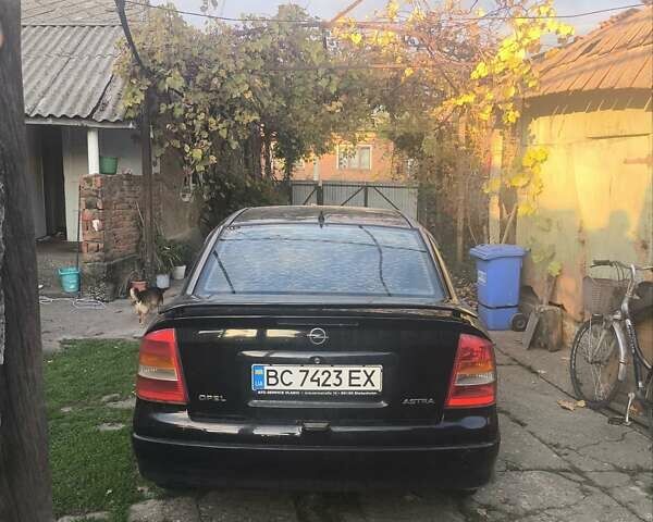 Черный Опель Астра, объемом двигателя 1.4 л и пробегом 250 тыс. км за 1800 $, фото 1 на Automoto.ua