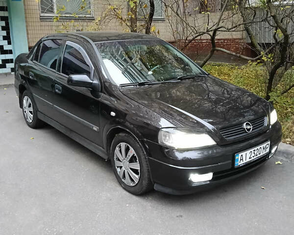 Черный Опель Астра, объемом двигателя 1.6 л и пробегом 274 тыс. км за 3500 $, фото 1 на Automoto.ua