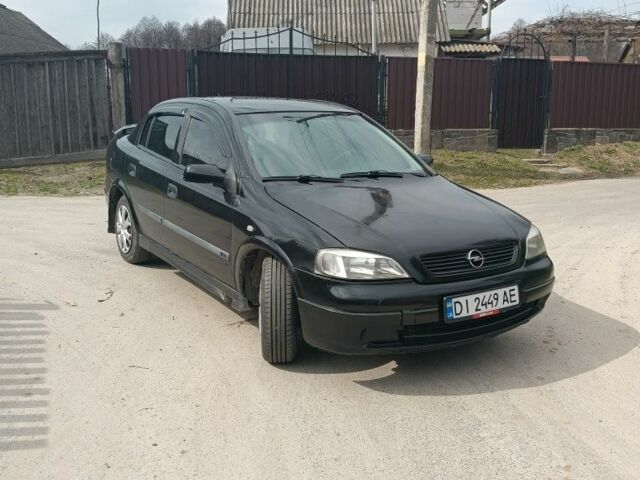 Черный Опель Астра, объемом двигателя 1.4 л и пробегом 270 тыс. км за 3200 $, фото 1 на Automoto.ua