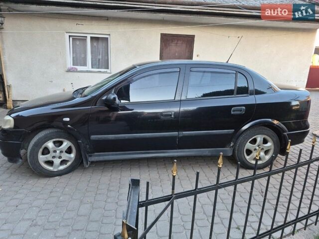 Черный Опель Астра, объемом двигателя 1.6 л и пробегом 319 тыс. км за 3100 $, фото 1 на Automoto.ua
