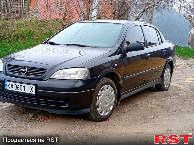 Черный Опель Астра, объемом двигателя 1.4 л и пробегом 330 тыс. км за 3600 $, фото 1 на Automoto.ua
