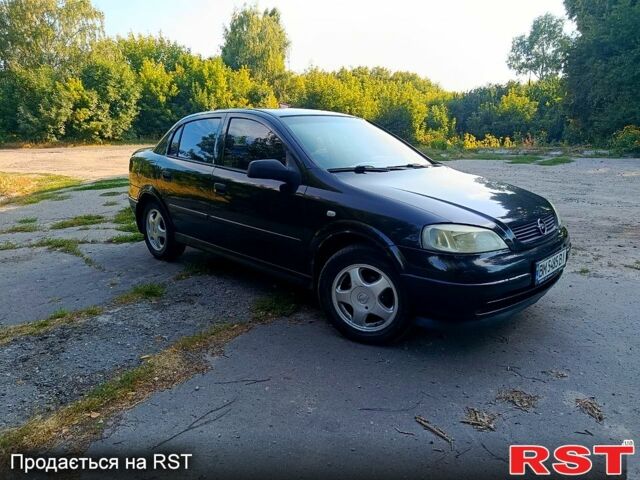 Черный Опель Астра, объемом двигателя 1.4 л и пробегом 249 тыс. км за 3100 $, фото 1 на Automoto.ua