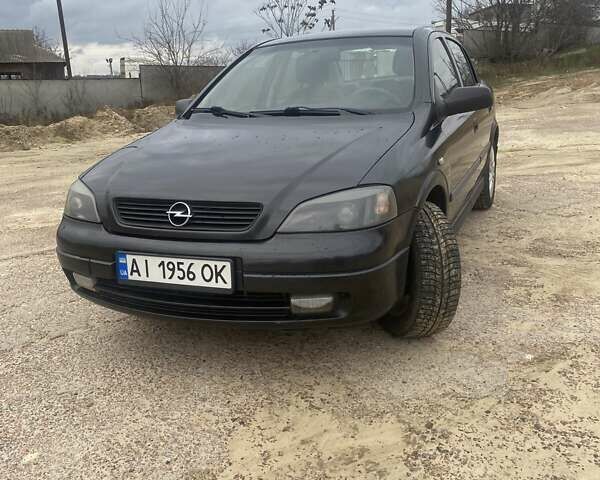 Черный Опель Астра, объемом двигателя 1.4 л и пробегом 349 тыс. км за 3650 $, фото 1 на Automoto.ua