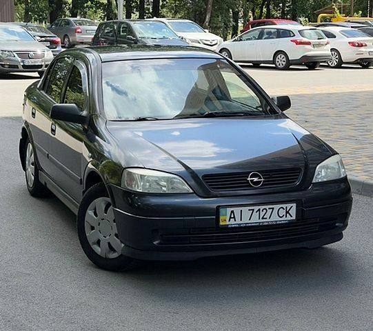 Черный Опель Астра, объемом двигателя 1.4 л и пробегом 184 тыс. км за 1999 $, фото 1 на Automoto.ua