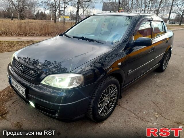Черный Опель Астра, объемом двигателя 1.4 л и пробегом 199 тыс. км за 4600 $, фото 1 на Automoto.ua