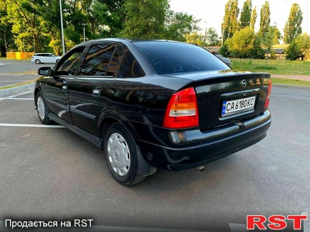 Черный Опель Астра, объемом двигателя 1.4 л и пробегом 270 тыс. км за 1750 $, фото 1 на Automoto.ua