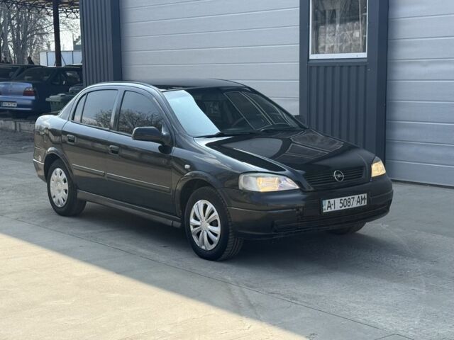 Черный Опель Астра, объемом двигателя 1.4 л и пробегом 210 тыс. км за 2350 $, фото 1 на Automoto.ua