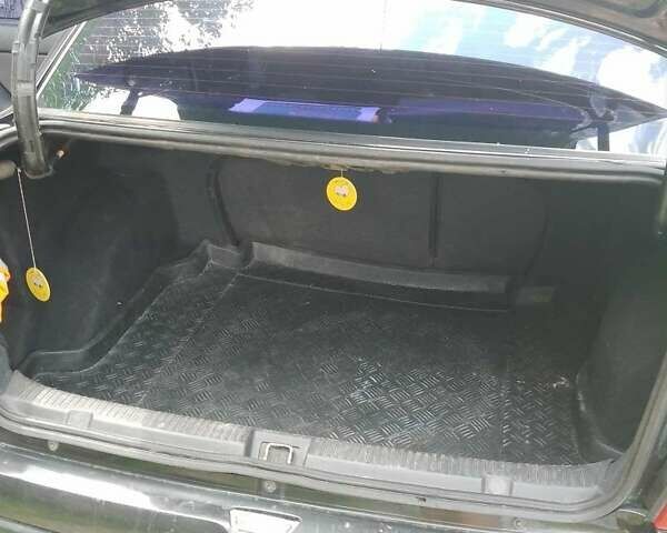 Черный Опель Астра, объемом двигателя 1.4 л и пробегом 243 тыс. км за 3200 $, фото 1 на Automoto.ua