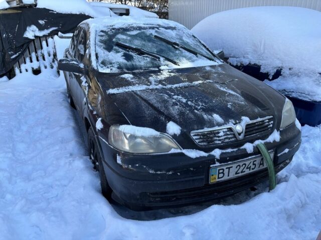 Черный Опель Астра, объемом двигателя 1.4 л и пробегом 380 тыс. км за 1400 $, фото 1 на Automoto.ua