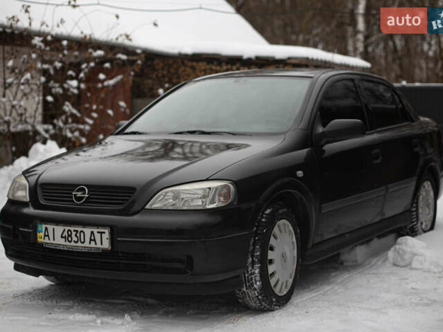 Черный Опель Астра, объемом двигателя 1.4 л и пробегом 360 тыс. км за 2800 $, фото 1 на Automoto.ua