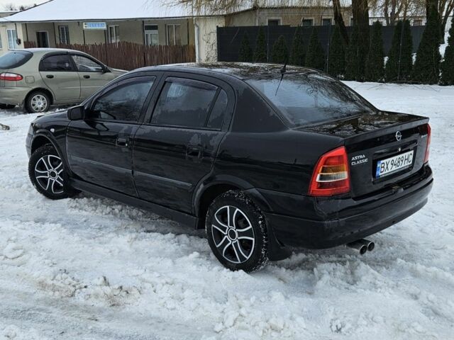 Черный Опель Астра, объемом двигателя 1.4 л и пробегом 200 тыс. км за 3300 $, фото 1 на Automoto.ua