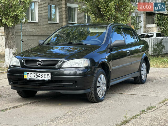 Черный Опель Астра, объемом двигателя 1.4 л и пробегом 216 тыс. км за 3700 $, фото 1 на Automoto.ua