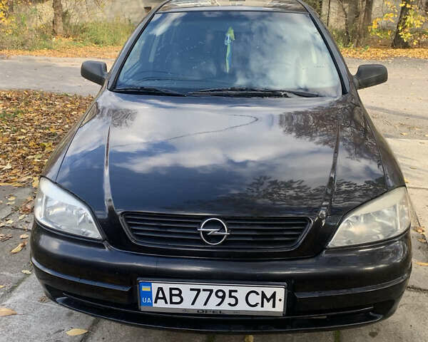 Черный Опель Астра, объемом двигателя 1.4 л и пробегом 216 тыс. км за 3500 $, фото 1 на Automoto.ua