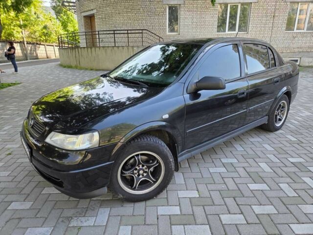 Черный Опель Астра, объемом двигателя 1.4 л и пробегом 159 тыс. км за 4999 $, фото 1 на Automoto.ua