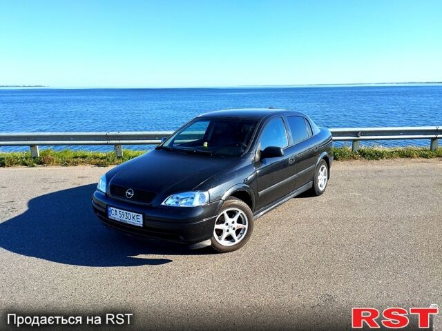 Черный Опель Астра, объемом двигателя 1.6 л и пробегом 270 тыс. км за 4000 $, фото 1 на Automoto.ua