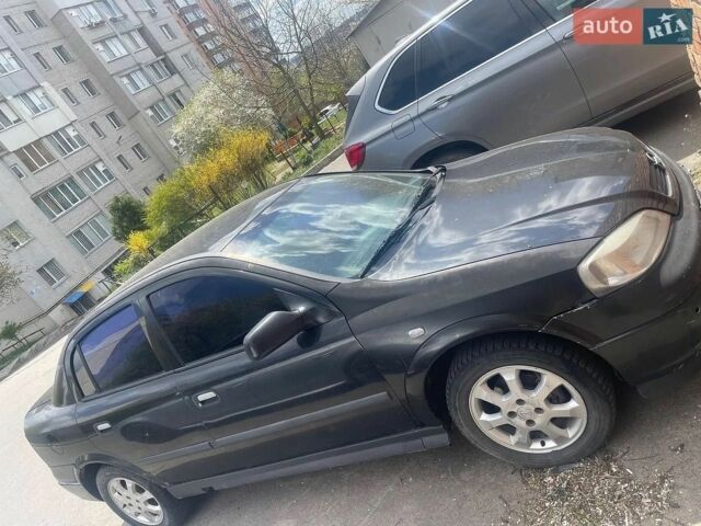 Черный Опель Астра, объемом двигателя 1.4 л и пробегом 180 тыс. км за 3000 $, фото 1 на Automoto.ua