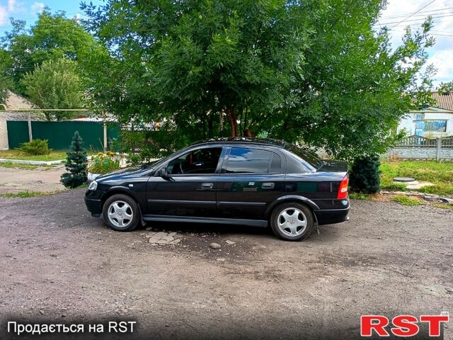 Черный Опель Астра, объемом двигателя 1.6 л и пробегом 137 тыс. км за 4600 $, фото 1 на Automoto.ua
