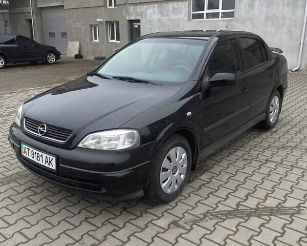 Черный Опель Астра, объемом двигателя 1.4 л и пробегом 229 тыс. км за 3200 $, фото 1 на Automoto.ua
