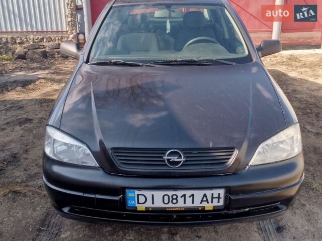 Черный Опель Астра, объемом двигателя 1.4 л и пробегом 173 тыс. км за 2100 $, фото 1 на Automoto.ua
