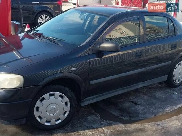 Черный Опель Астра, объемом двигателя 1.39 л и пробегом 150 тыс. км за 3200 $, фото 1 на Automoto.ua