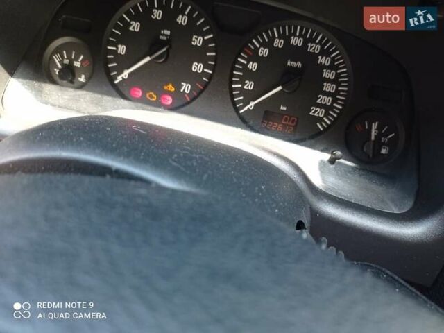 Черный Опель Астра, объемом двигателя 1.39 л и пробегом 230 тыс. км за 5000 $, фото 1 на Automoto.ua