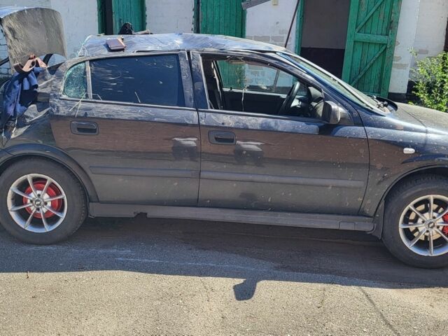 Черный Опель Астра, объемом двигателя 1.6 л и пробегом 254 тыс. км за 903 $, фото 1 на Automoto.ua