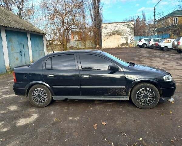 Черный Опель Астра, объемом двигателя 1.4 л и пробегом 180 тыс. км за 4500 $, фото 1 на Automoto.ua