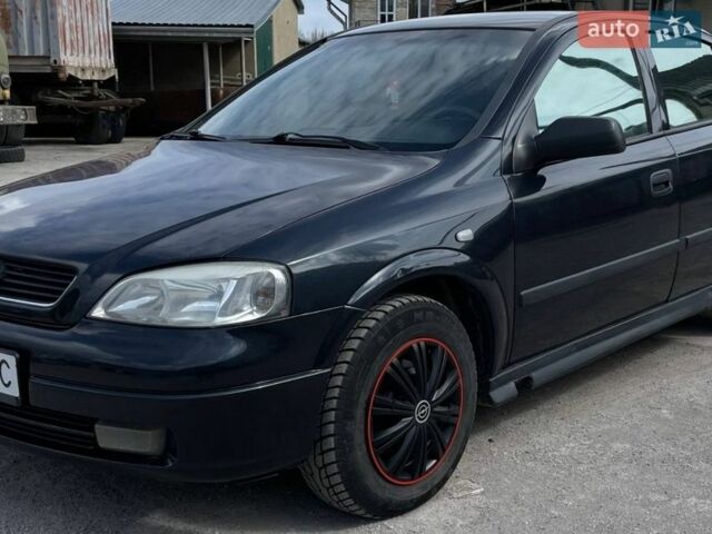 Черный Опель Астра, объемом двигателя 1.4 л и пробегом 270 тыс. км за 3000 $, фото 1 на Automoto.ua