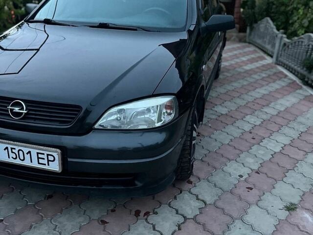 Черный Опель Астра, объемом двигателя 1.6 л и пробегом 207 тыс. км за 3500 $, фото 1 на Automoto.ua
