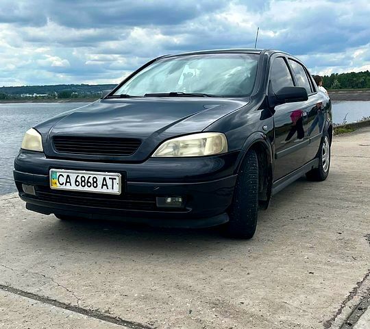 Черный Опель Астра, объемом двигателя 1.6 л и пробегом 188 тыс. км за 3750 $, фото 1 на Automoto.ua