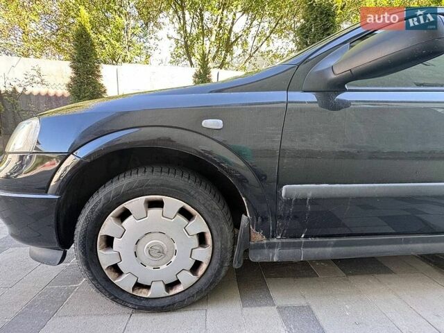 Черный Опель Астра, объемом двигателя 1.39 л и пробегом 142 тыс. км за 3500 $, фото 1 на Automoto.ua