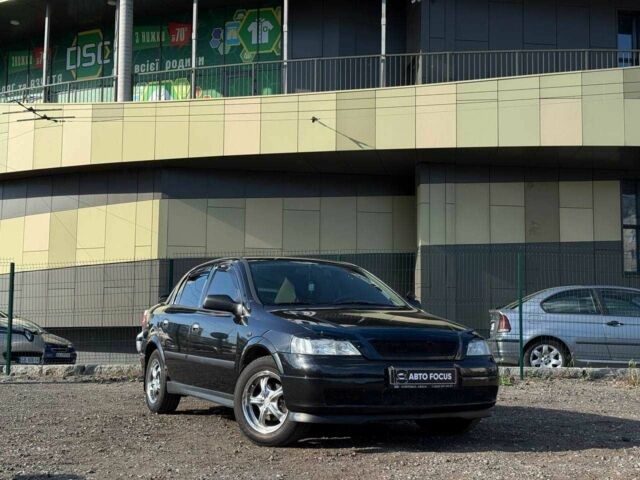 Черный Опель Астра, объемом двигателя 2 л и пробегом 260 тыс. км за 3790 $, фото 1 на Automoto.ua