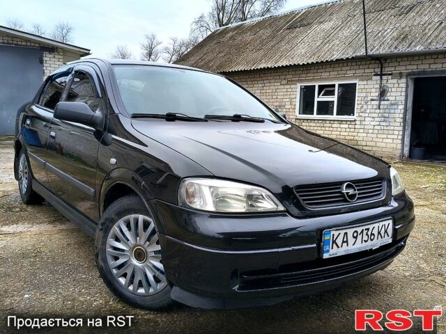 Черный Опель Астра, объемом двигателя 1.4 л и пробегом 250 тыс. км за 3999 $, фото 1 на Automoto.ua
