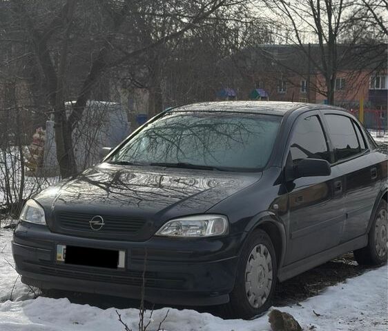 Черный Опель Астра, объемом двигателя 1.4 л и пробегом 130 тыс. км за 3000 $, фото 1 на Automoto.ua