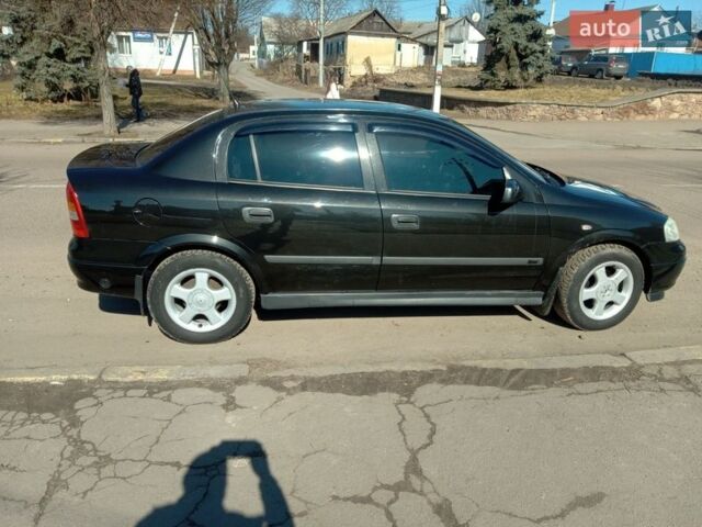 Черный Опель Астра, объемом двигателя 1.6 л и пробегом 164 тыс. км за 4500 $, фото 1 на Automoto.ua