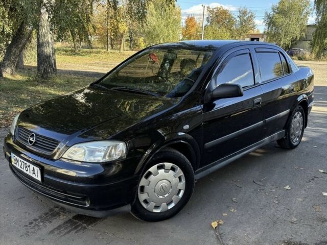 Черный Опель Астра, объемом двигателя 1.4 л и пробегом 250 тыс. км за 3700 $, фото 1 на Automoto.ua
