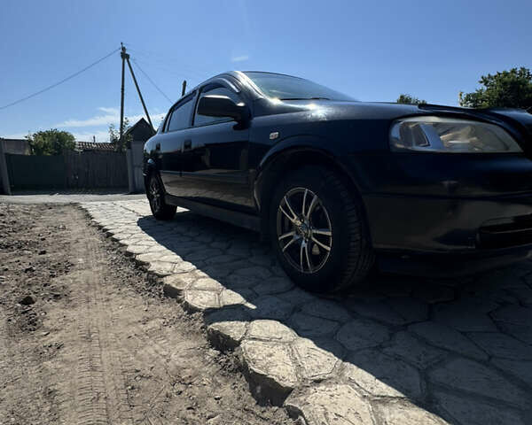 Черный Опель Астра, объемом двигателя 1.6 л и пробегом 262 тыс. км за 4500 $, фото 1 на Automoto.ua