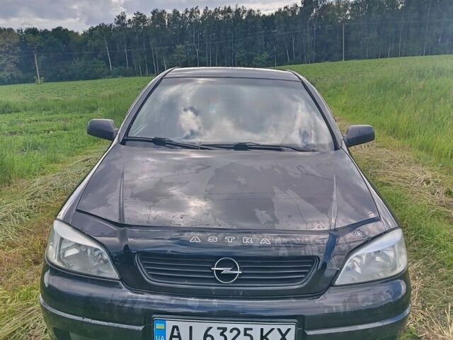 Черный Опель Астра, объемом двигателя 1.6 л и пробегом 230 тыс. км за 3300 $, фото 1 на Automoto.ua