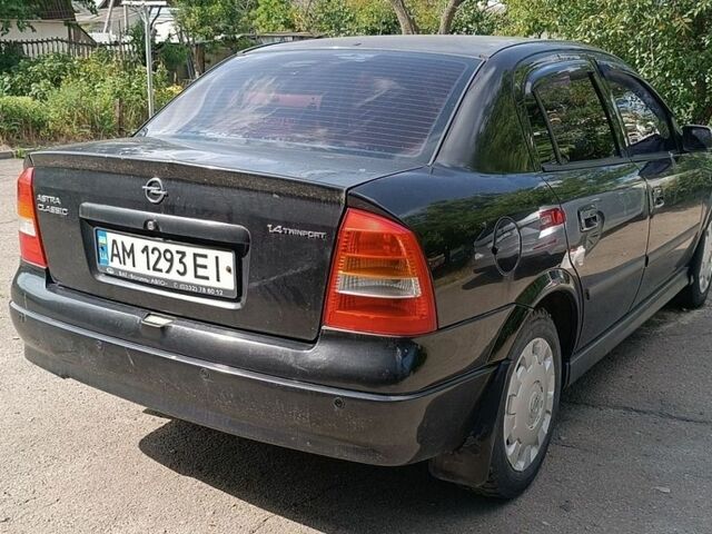 Черный Опель Астра, объемом двигателя 1.4 л и пробегом 243 тыс. км за 3500 $, фото 1 на Automoto.ua